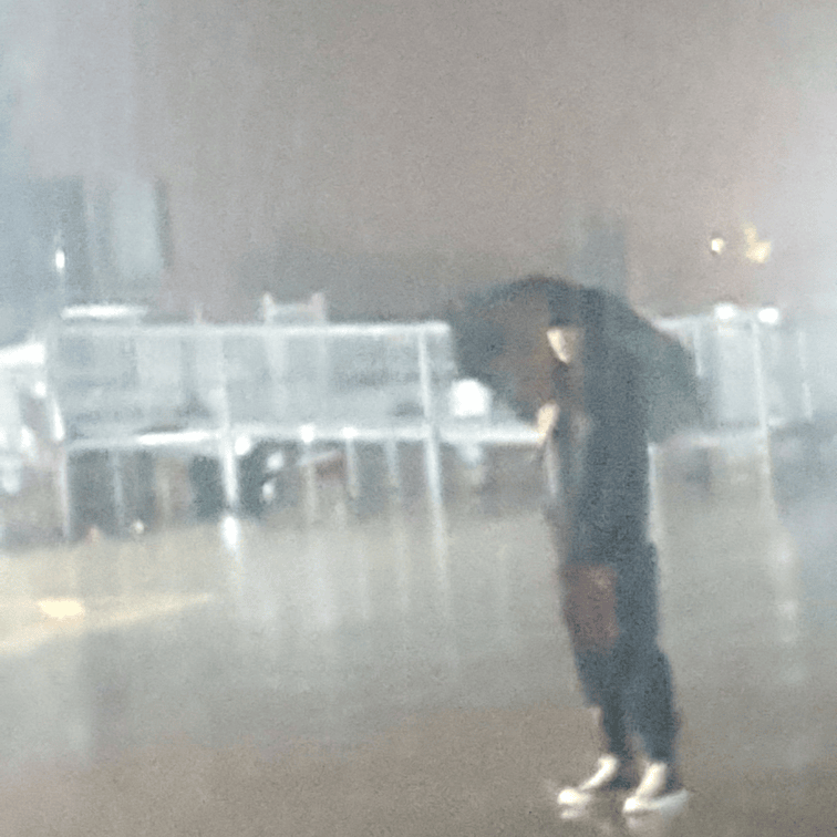 me standing in the rain with an umbrella